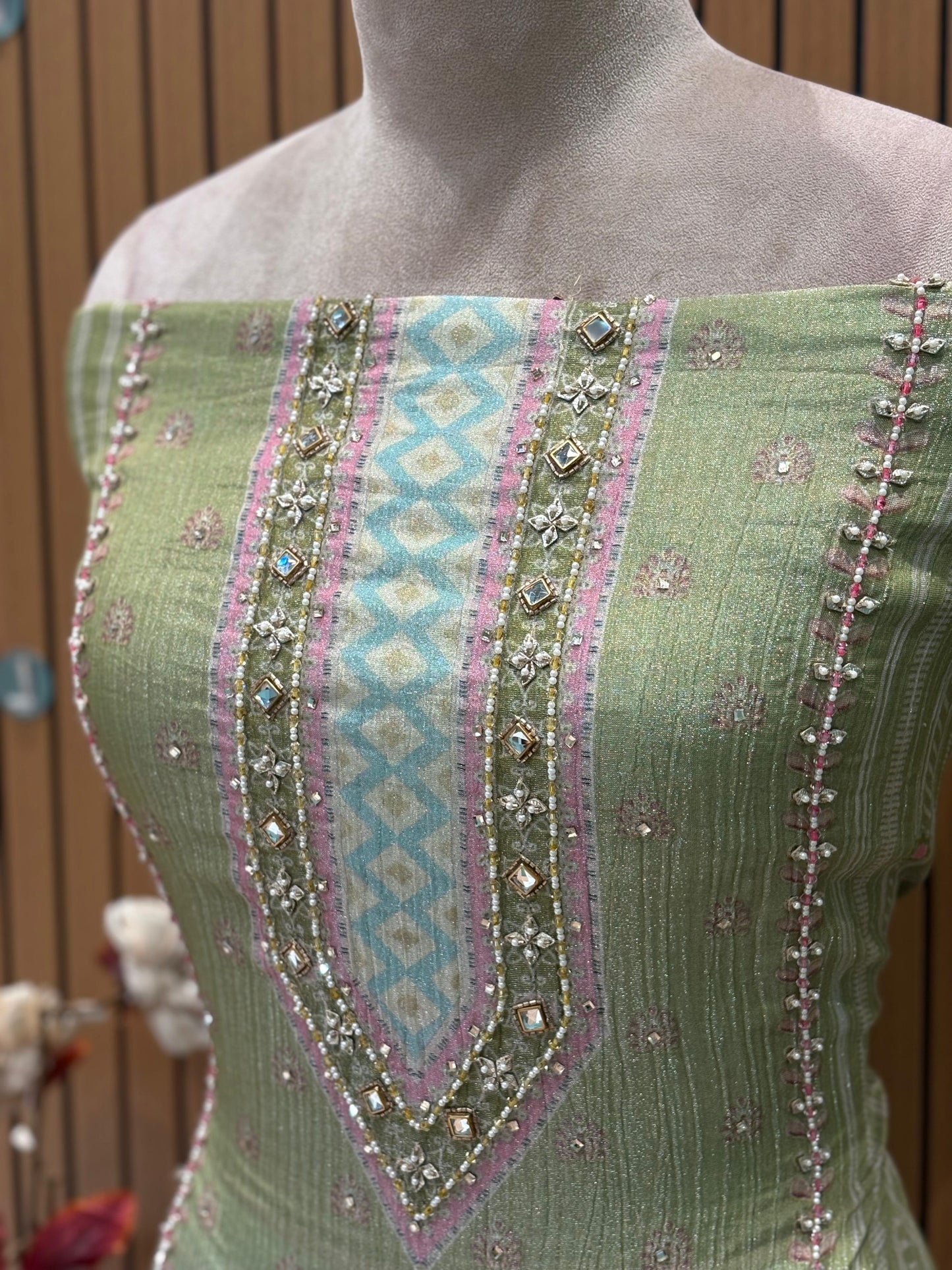 Step into elegance with this exquisite unstitched suit set