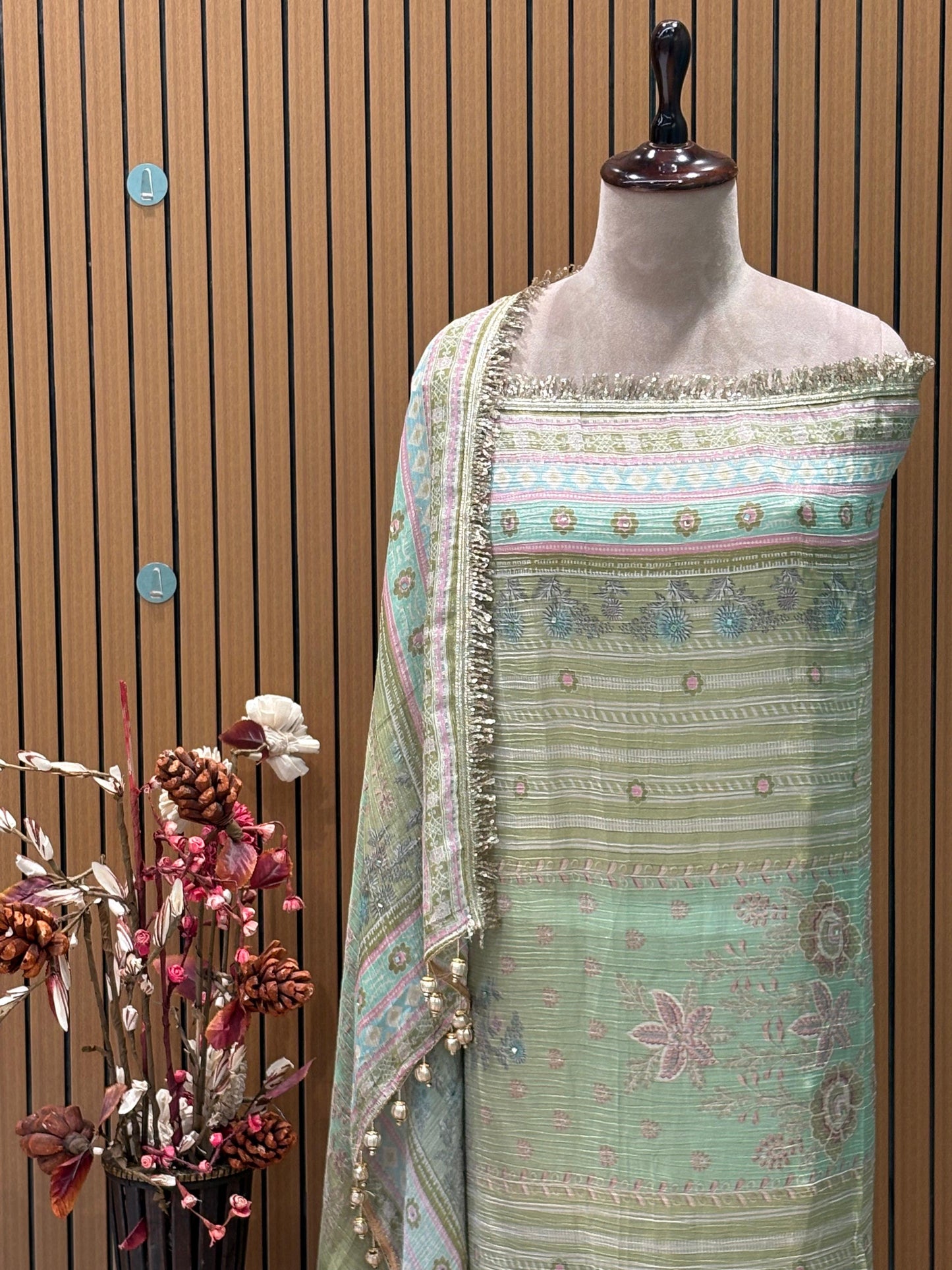 Step into elegance with this exquisite unstitched suit set