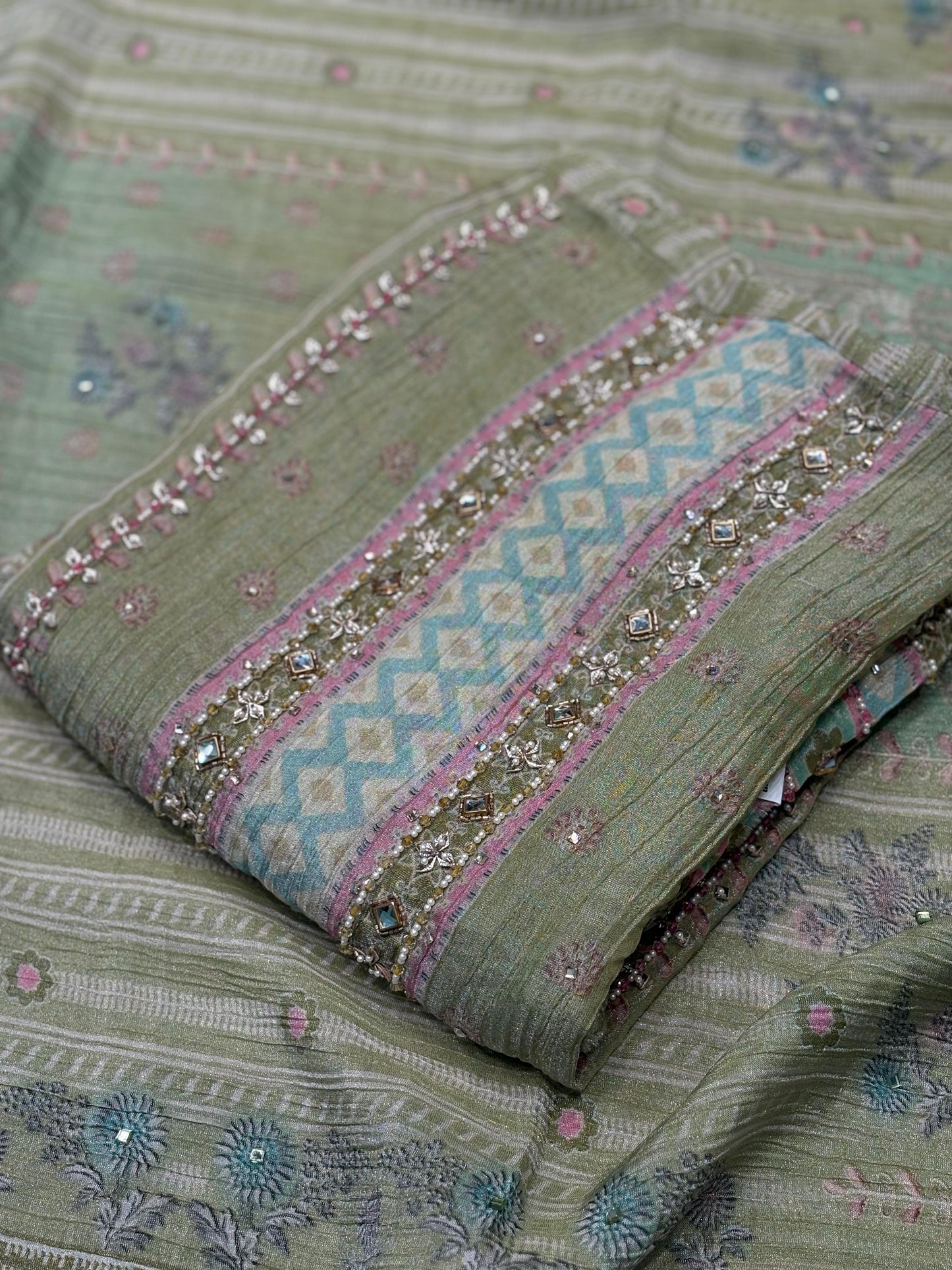 Step into elegance with this exquisite unstitched suit set