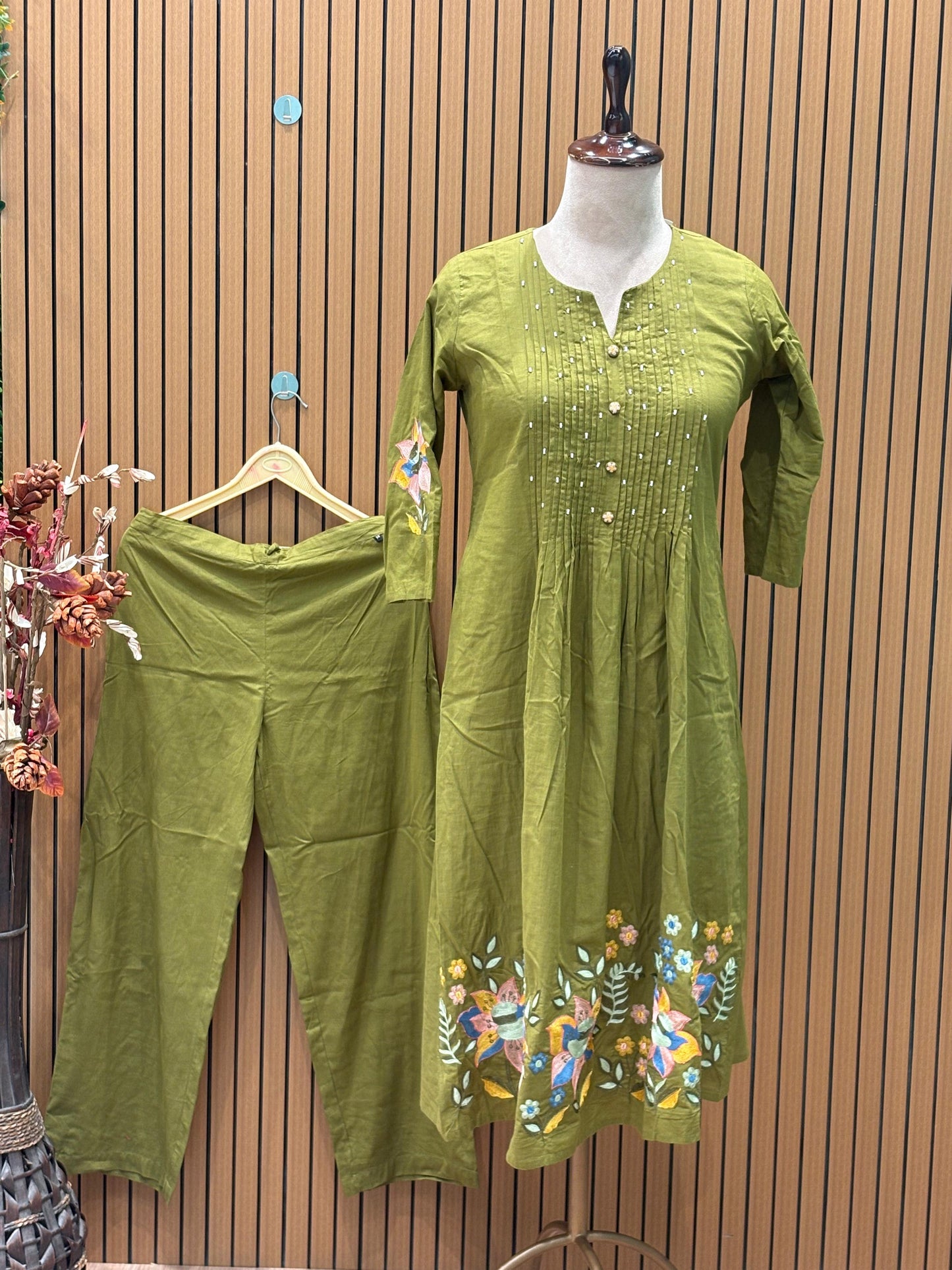 A soft and breathable cotton fabric in a rich olive green shade