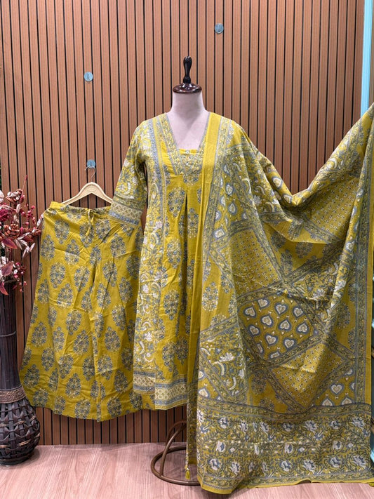 Vibrant yellow Anarkali set in pure cotton features intricate ethnic prints