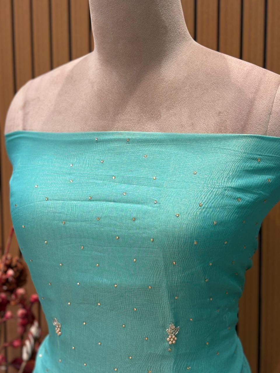 Unveil festive elegance with our luxurious unstitched suit