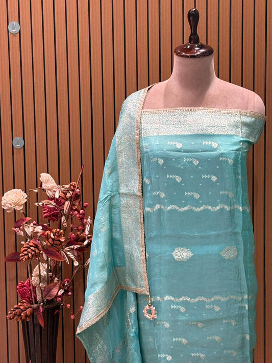 Unveil festive elegance with our luxurious unstitched suit