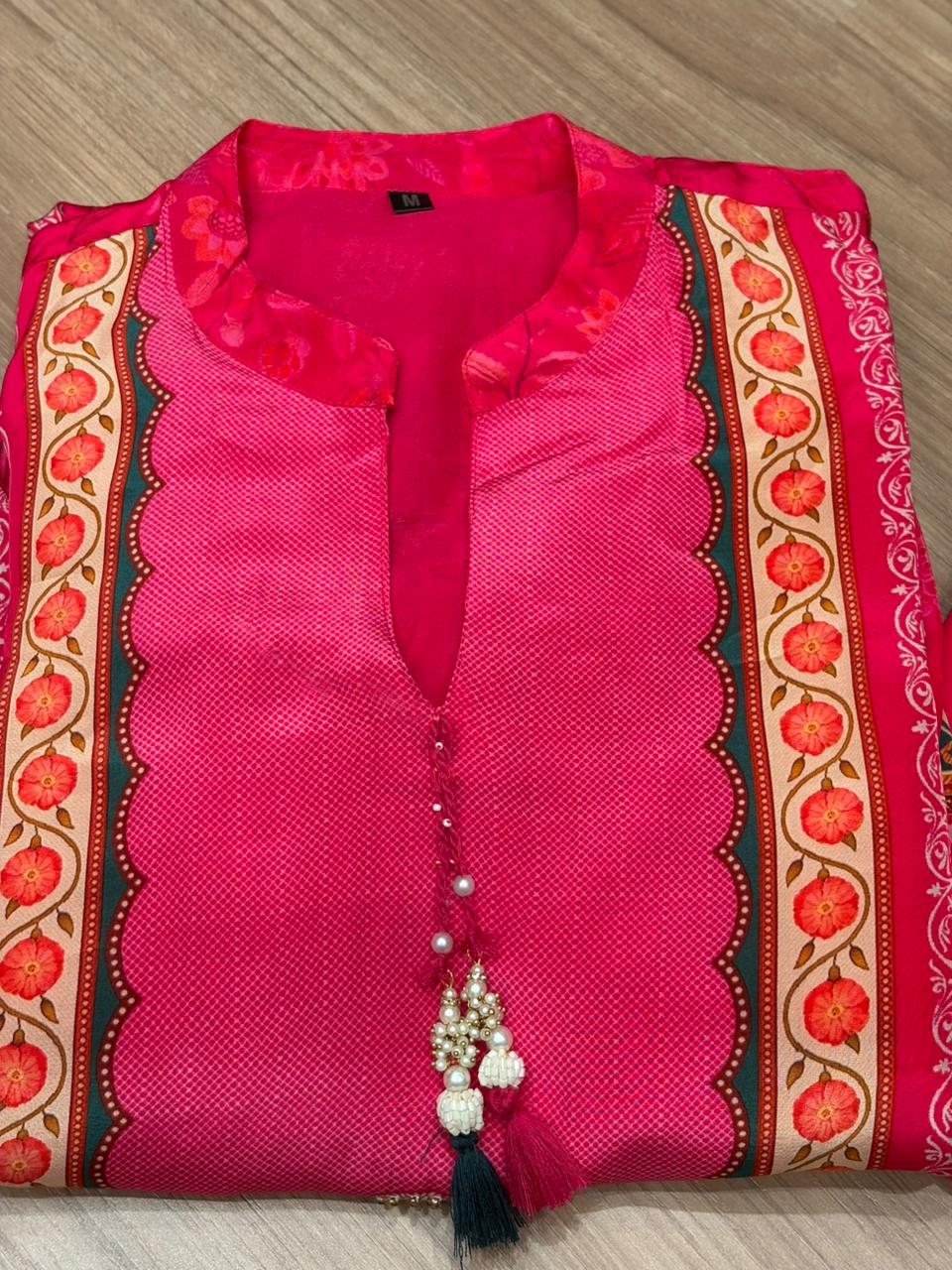Radiate festive charm in this vibrant pink crape suit set
