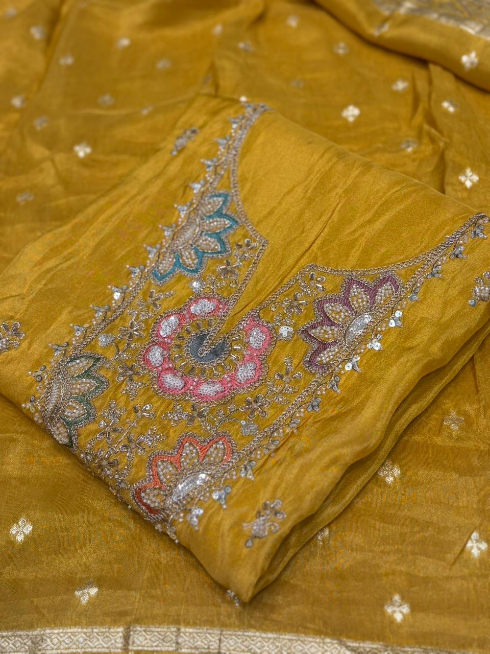 Experience sheer elegance with this exquisite unstitched suit set