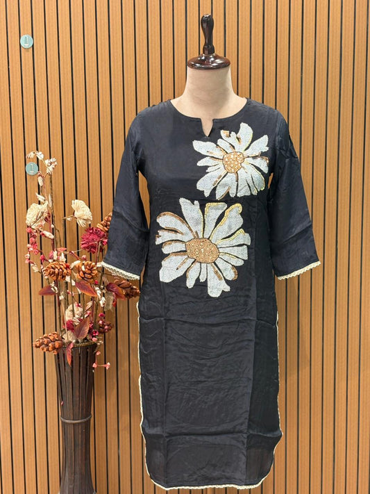 Elegance meets comfort in this black muslin kurti set