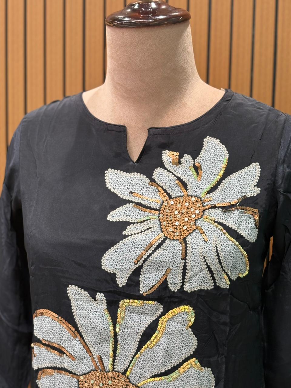 Elegance meets comfort in this black muslin kurti set