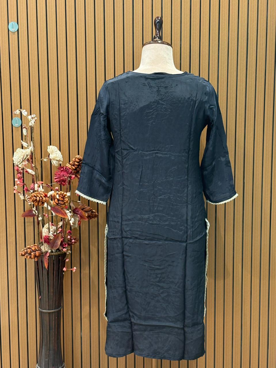 Elegance meets comfort in this black muslin kurti set