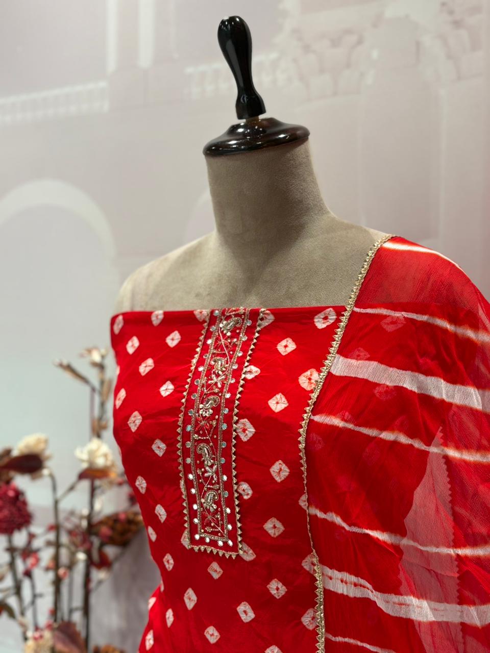 Unstitched elegance meets tradition in this stunning Bandhej print suit set