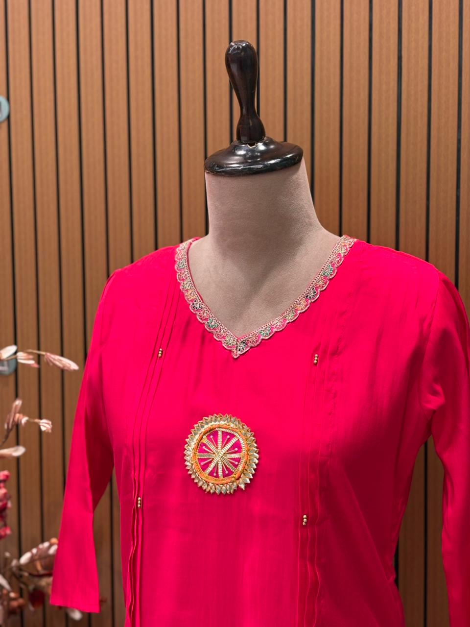 Grace your festive wardrobe with this vibrant pink muslin kurti set,