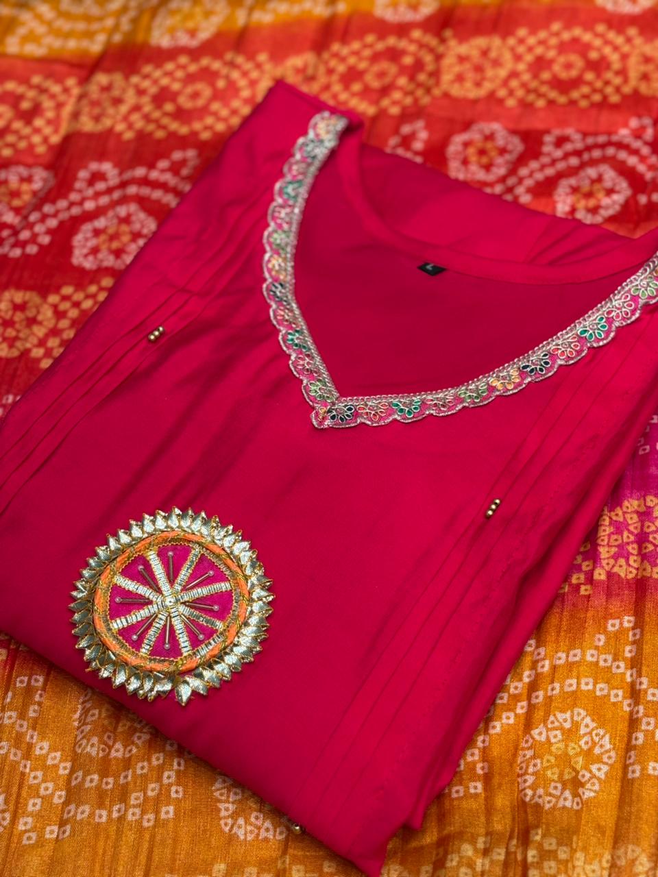 Grace your festive wardrobe with this vibrant pink muslin kurti set,