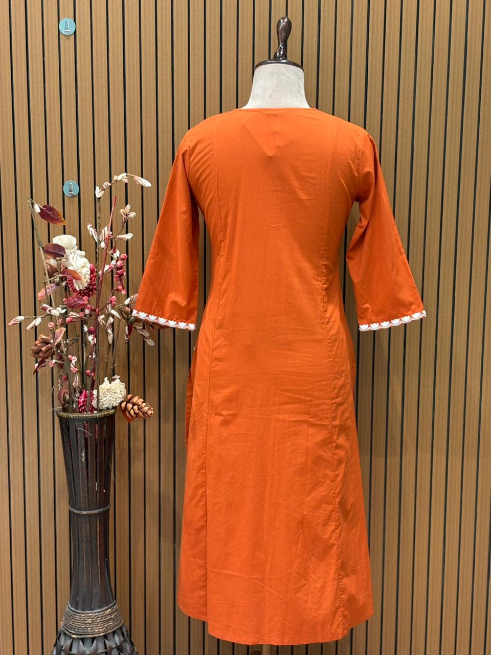 Graceful A-line cotton kurti set in vibrant orange