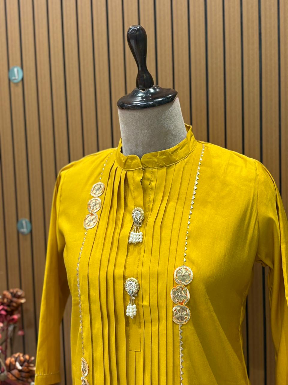 Brighten your festive look with this mustard muslin kurti set