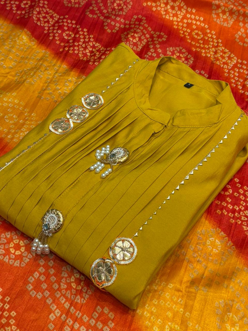 Brighten your festive look with this mustard muslin kurti set