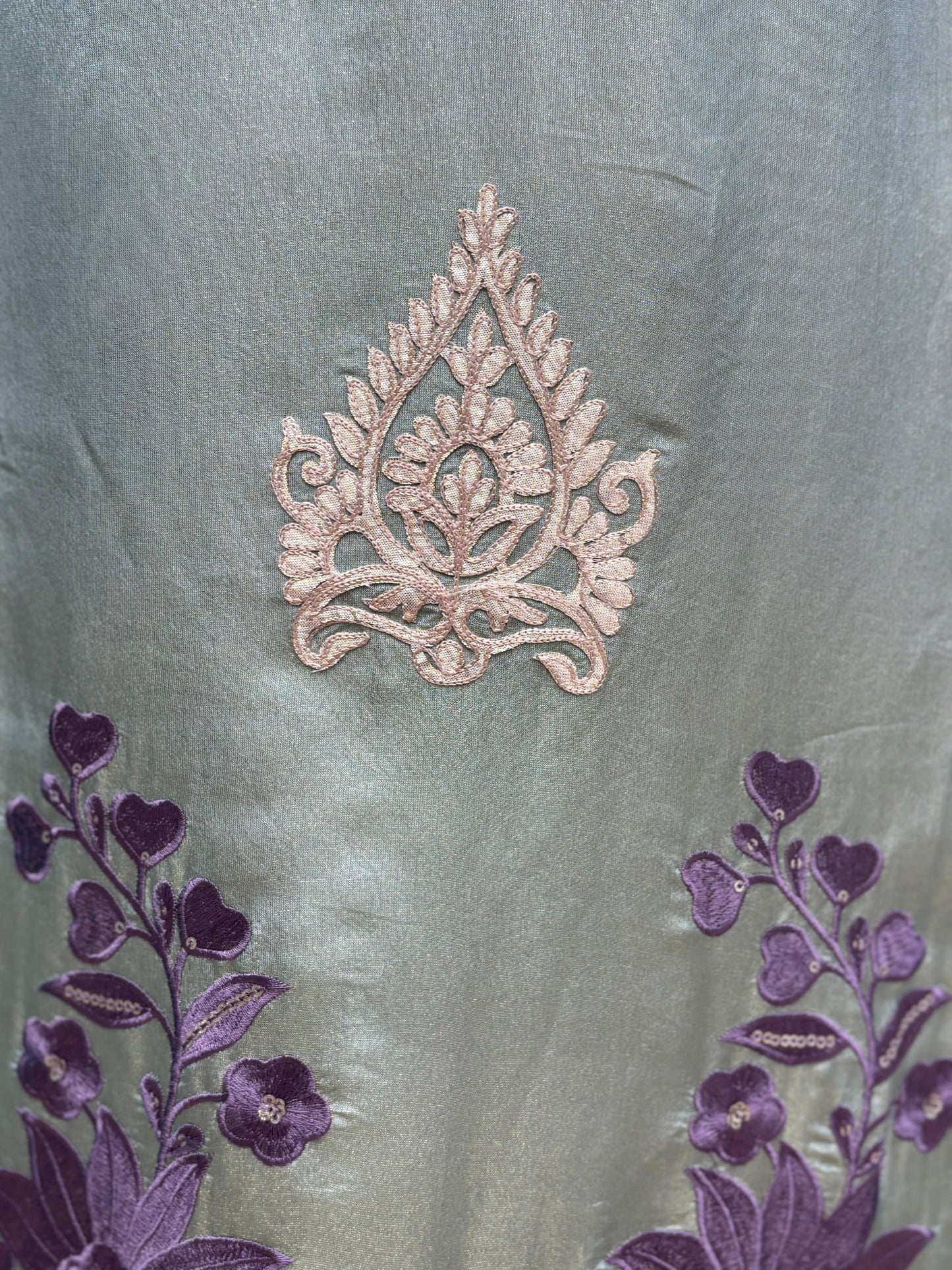 Step into elegance with our premium unstitched organza shimmer suits