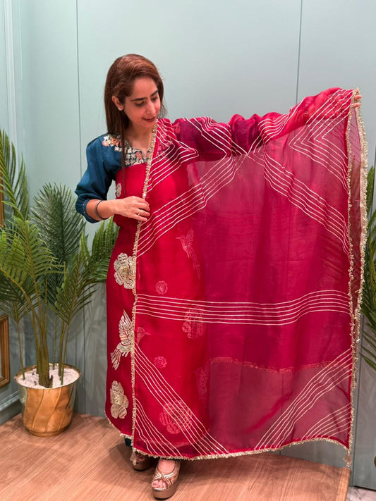 Crafted in organza shimmer fabric with rich gota patch work