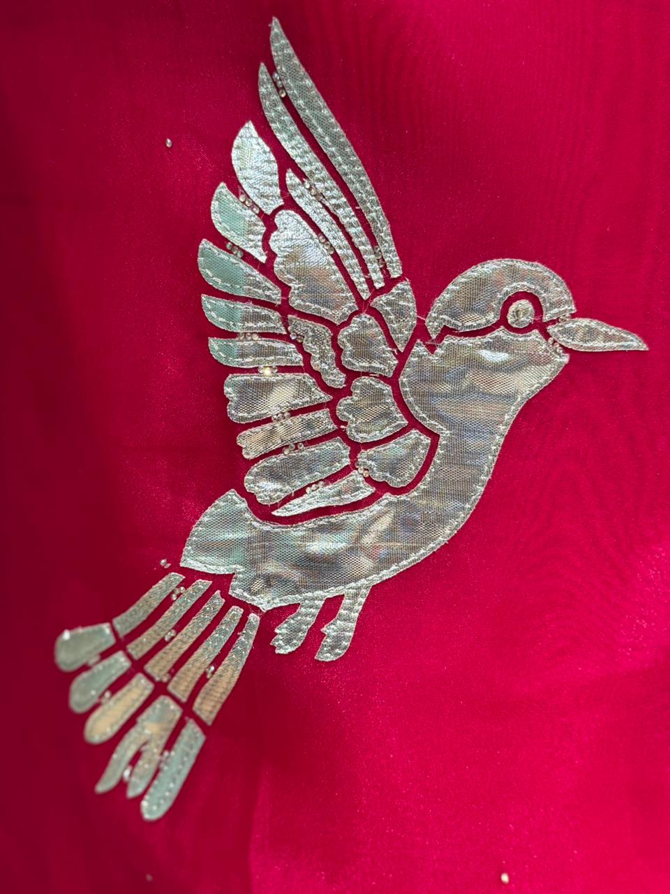 Crafted in organza shimmer fabric with rich gota patch work