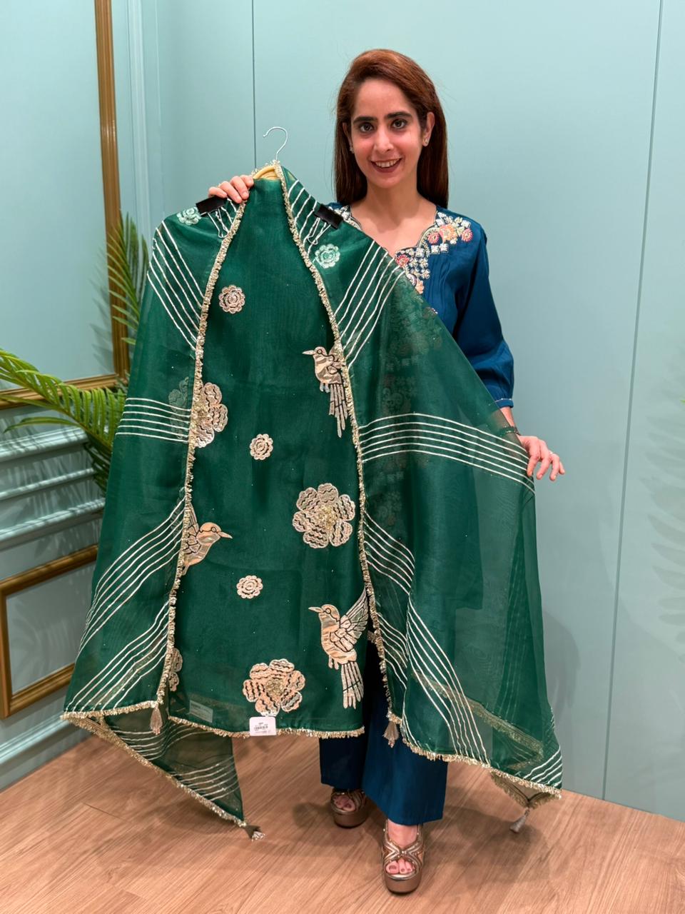 Crafted in organza shimmer fabric with rich gota patch work