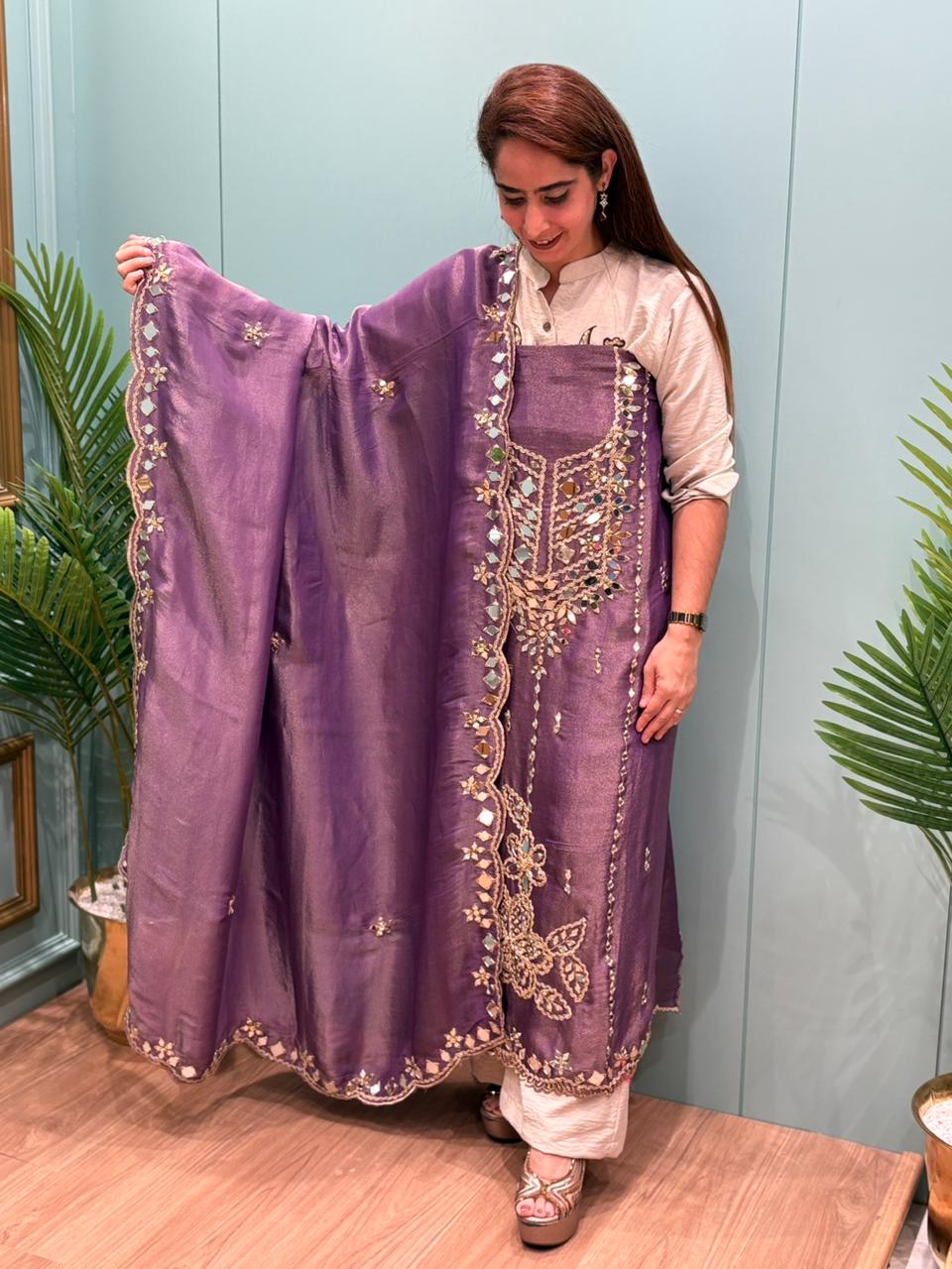 Organza Shimmer Unstitched Suit featuring all-over mirror work