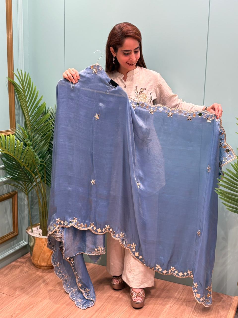 Organza Shimmer Unstitched Suit featuring all-over mirror work