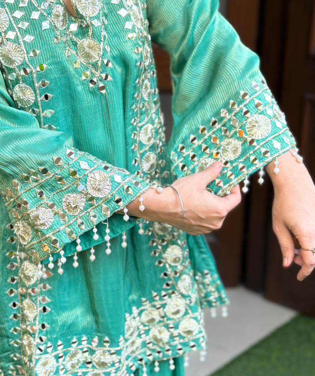 Crafted in luxurious shimmer organza