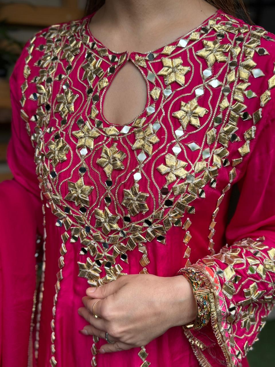 Exquisite short Anarkali set is beautifully crafted in luxurious Upada silk