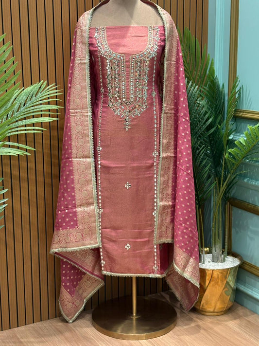 Regal unstitched suit set is crafted in elite shimmery organza fabric