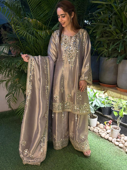 Exquisite Anarkali set is crafted in luxurious tissue silk fabric