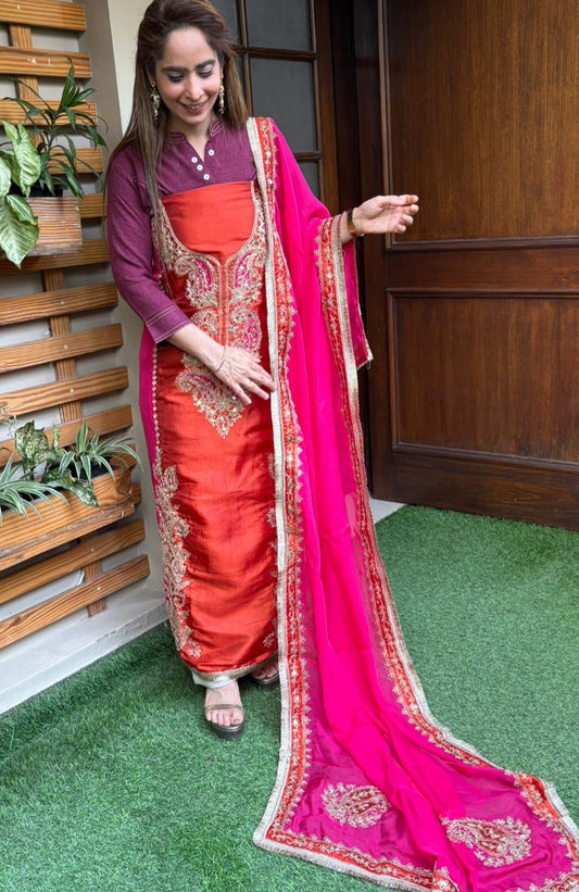Elegant unstitched suit is crafted in rich silk fabric