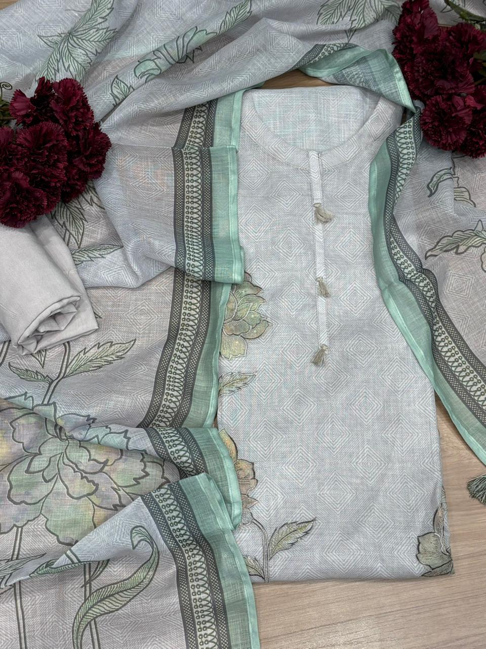 Elegant unstitched suit is crafted in breathable linen cotton fabric