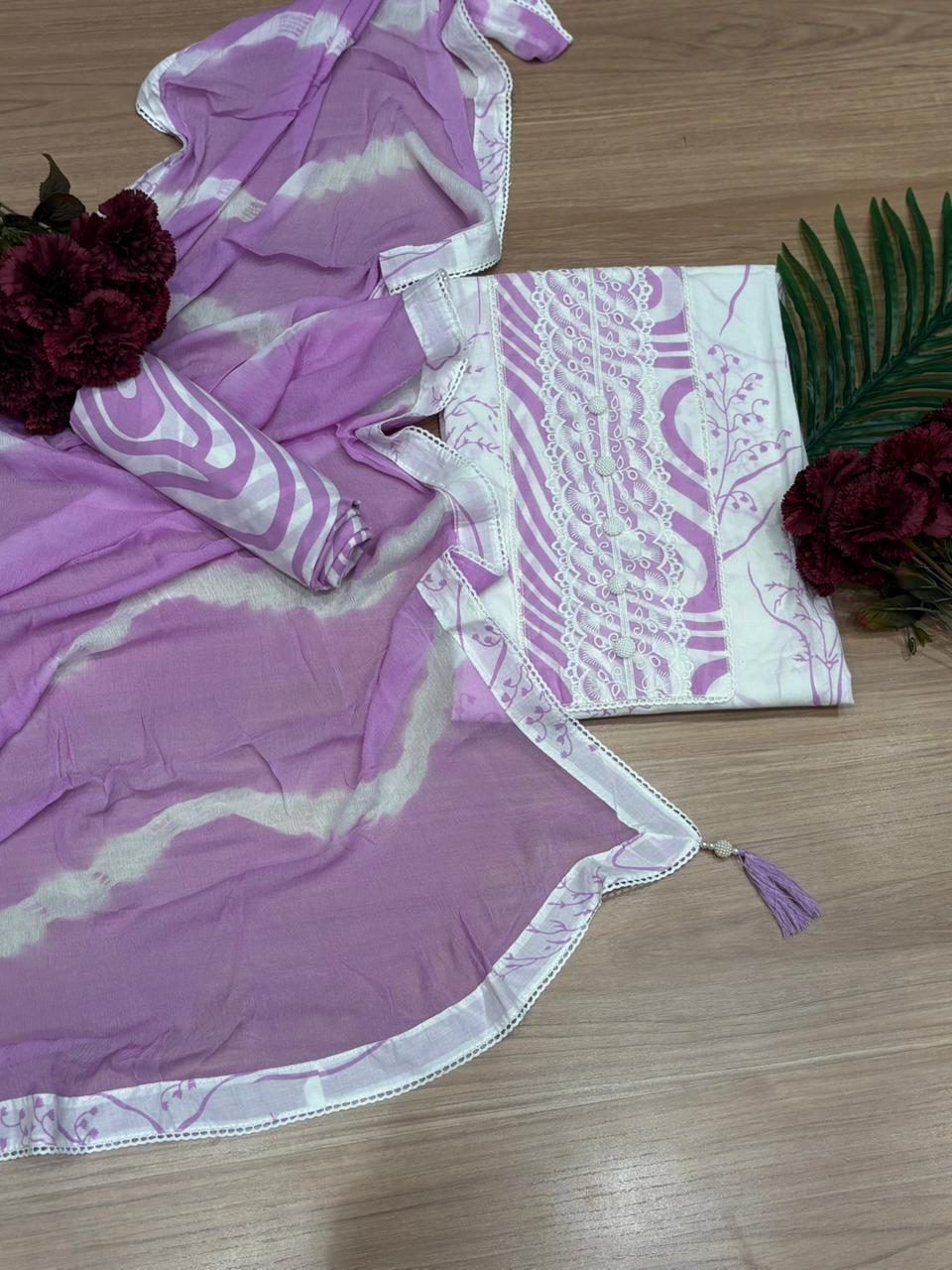 Elegant unstitched suit set is crafted from soft and breathable cotton fabric