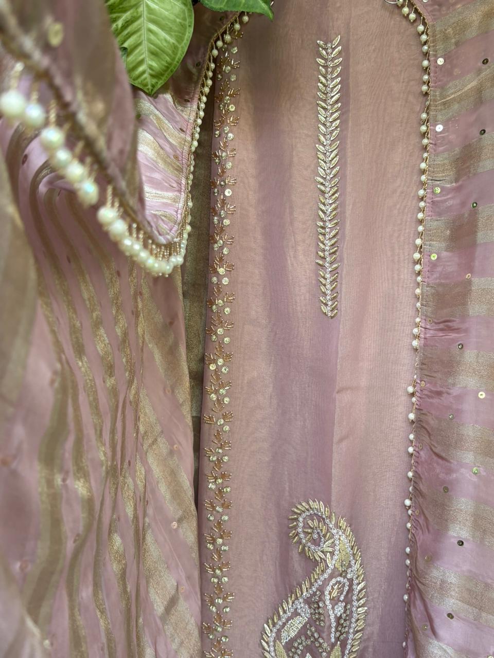 Unstitched suit crafted in rich tissue shimmer fabric