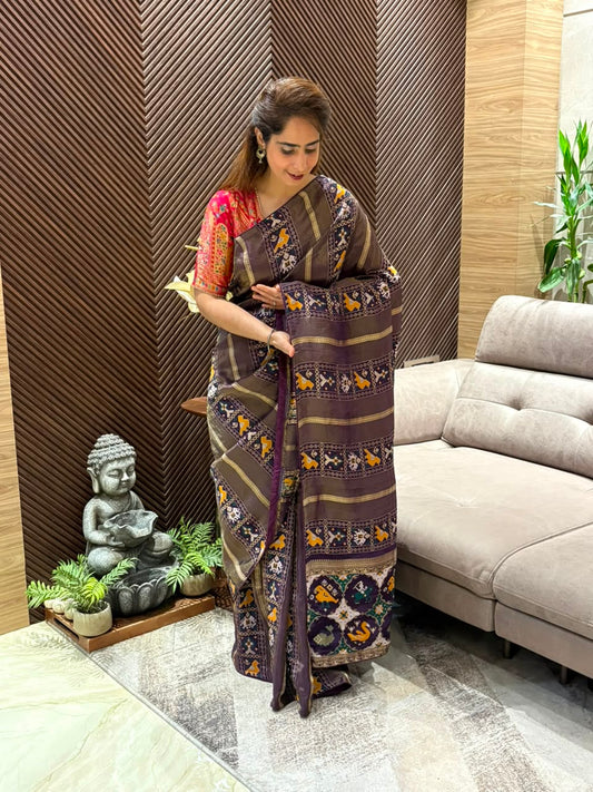 Elegant Patola Running Saree paired with an unstitched blouse