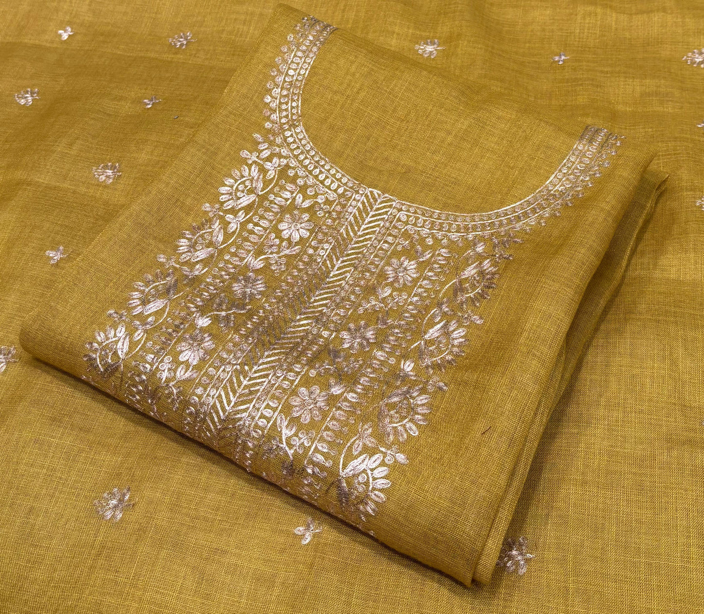 Step into festive finesse with this unstitched suit set