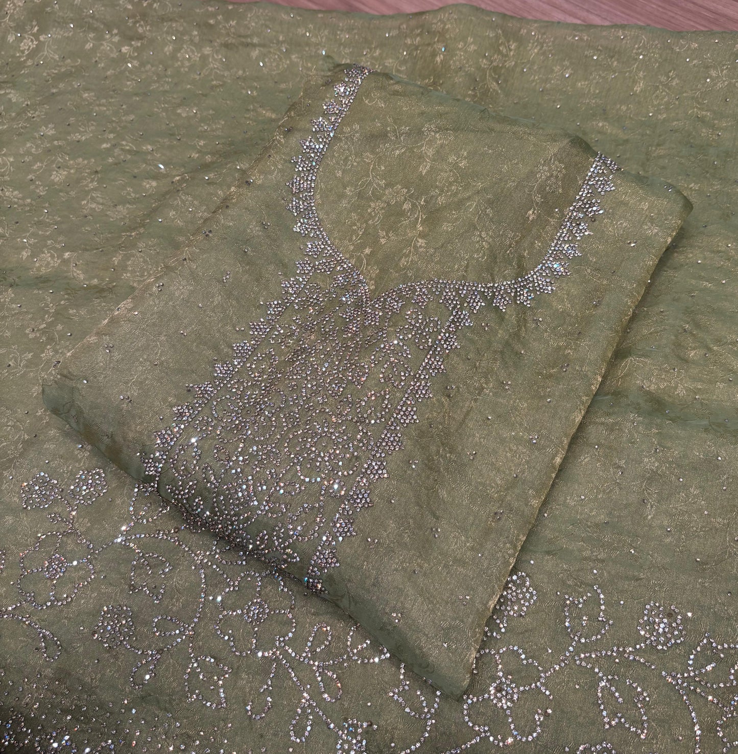 Unveil festive elegance with this stunning unstitched suit