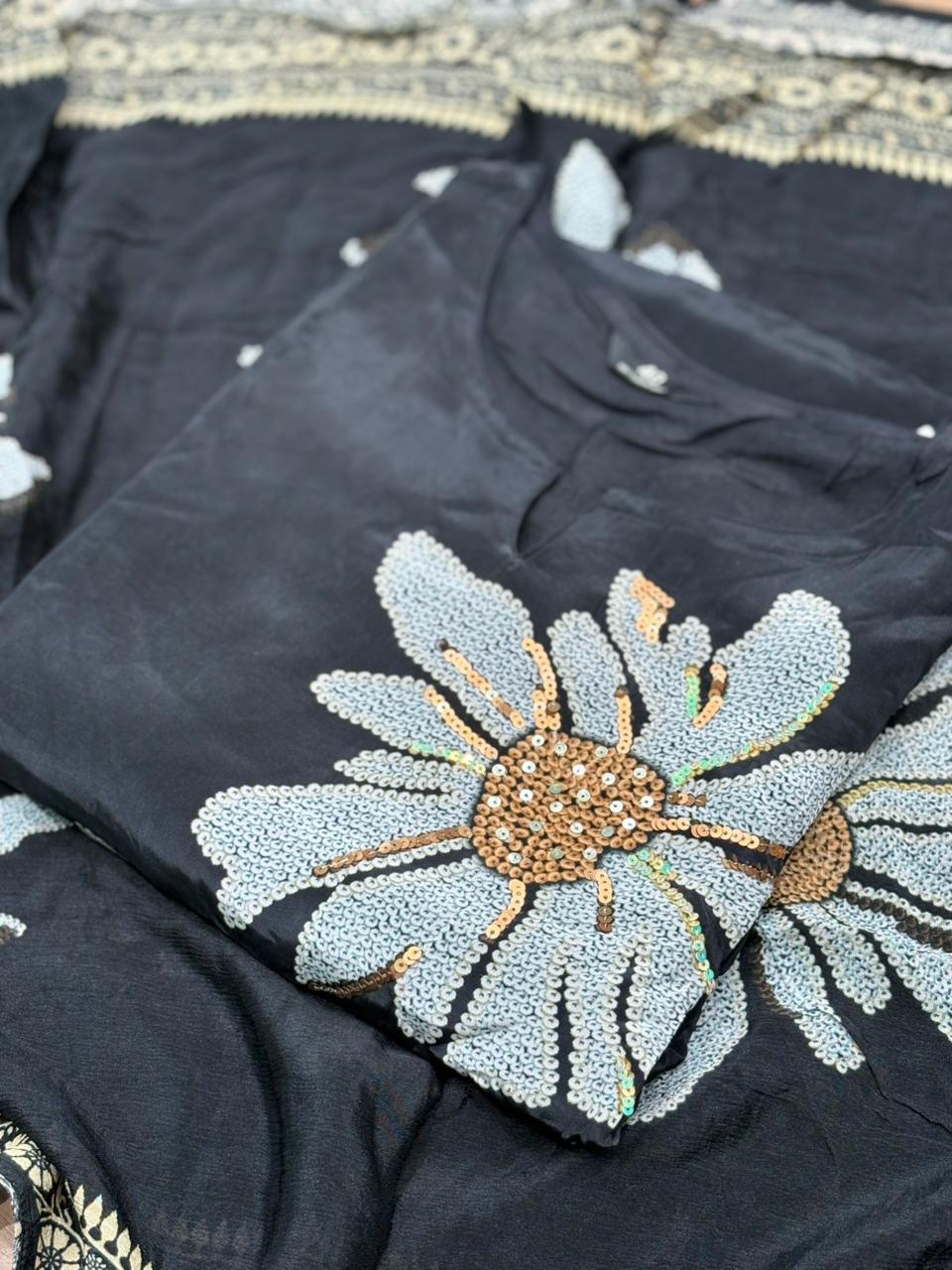 Elegance meets comfort in this black muslin kurti set