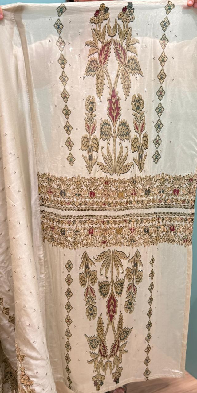 Elevate your festive wardrobe with our luxurious unstitched suit