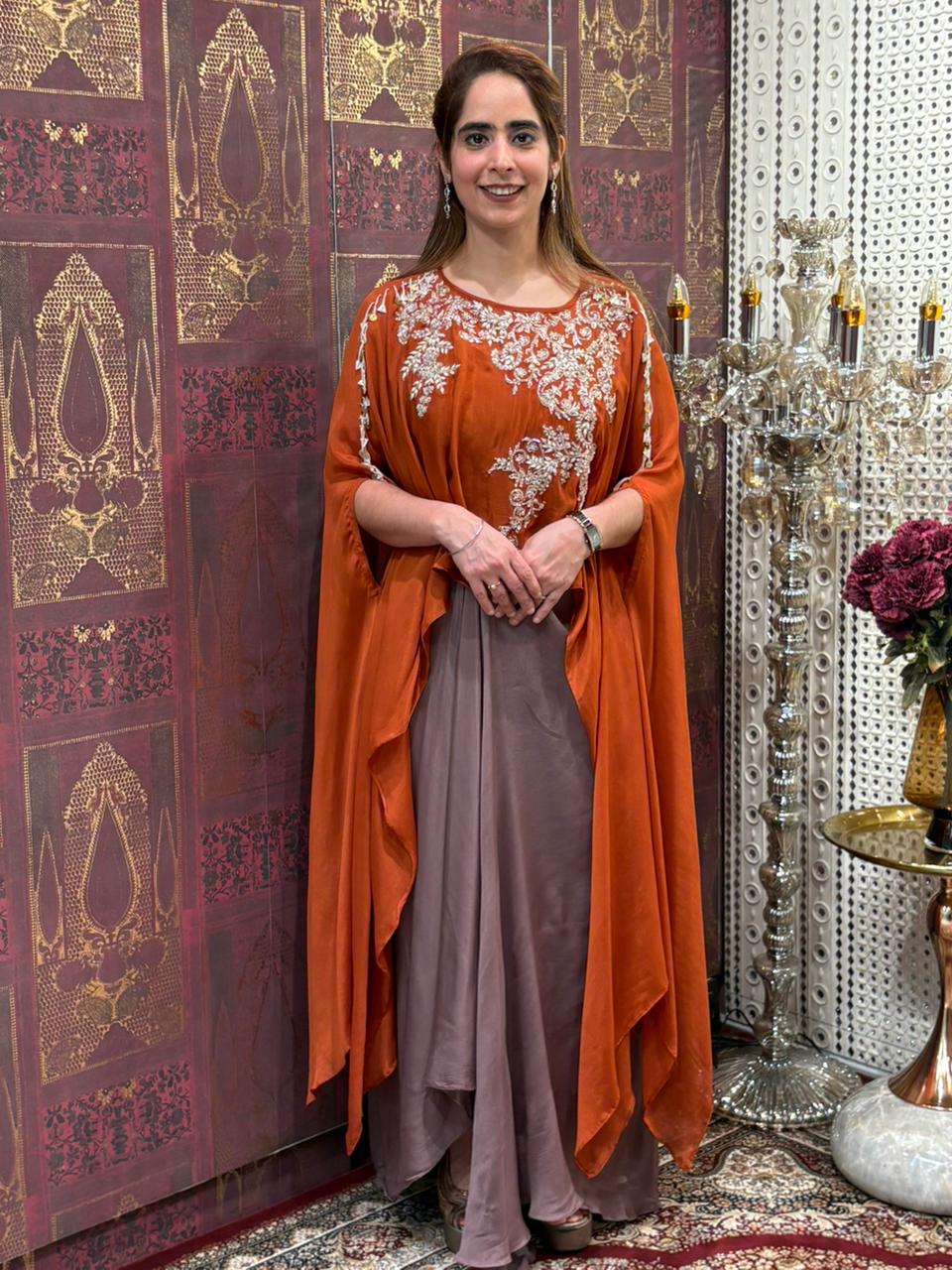 Elegant crop top with dhoti skirt and flowing cape