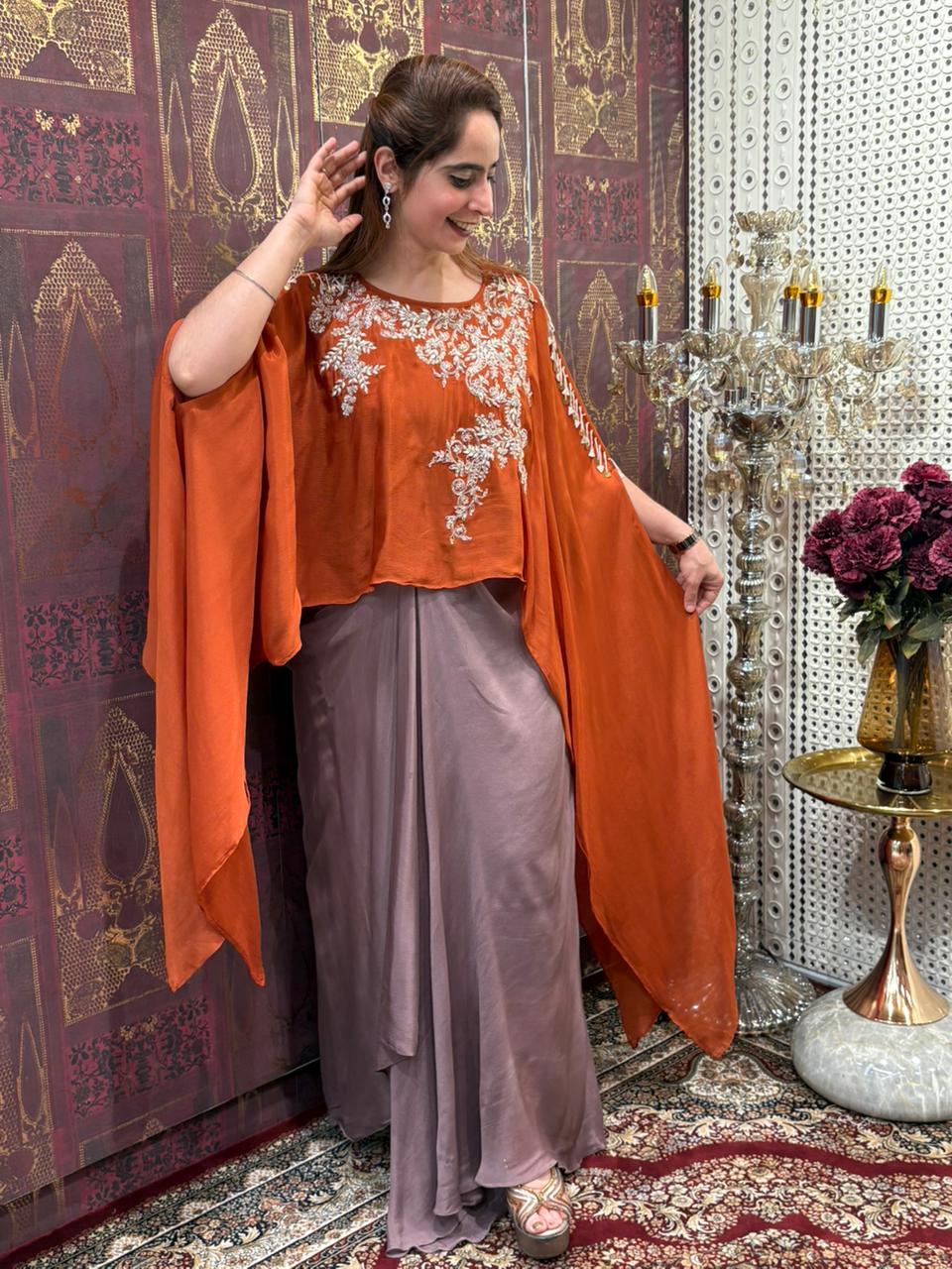 Elegant crop top with dhoti skirt and flowing cape