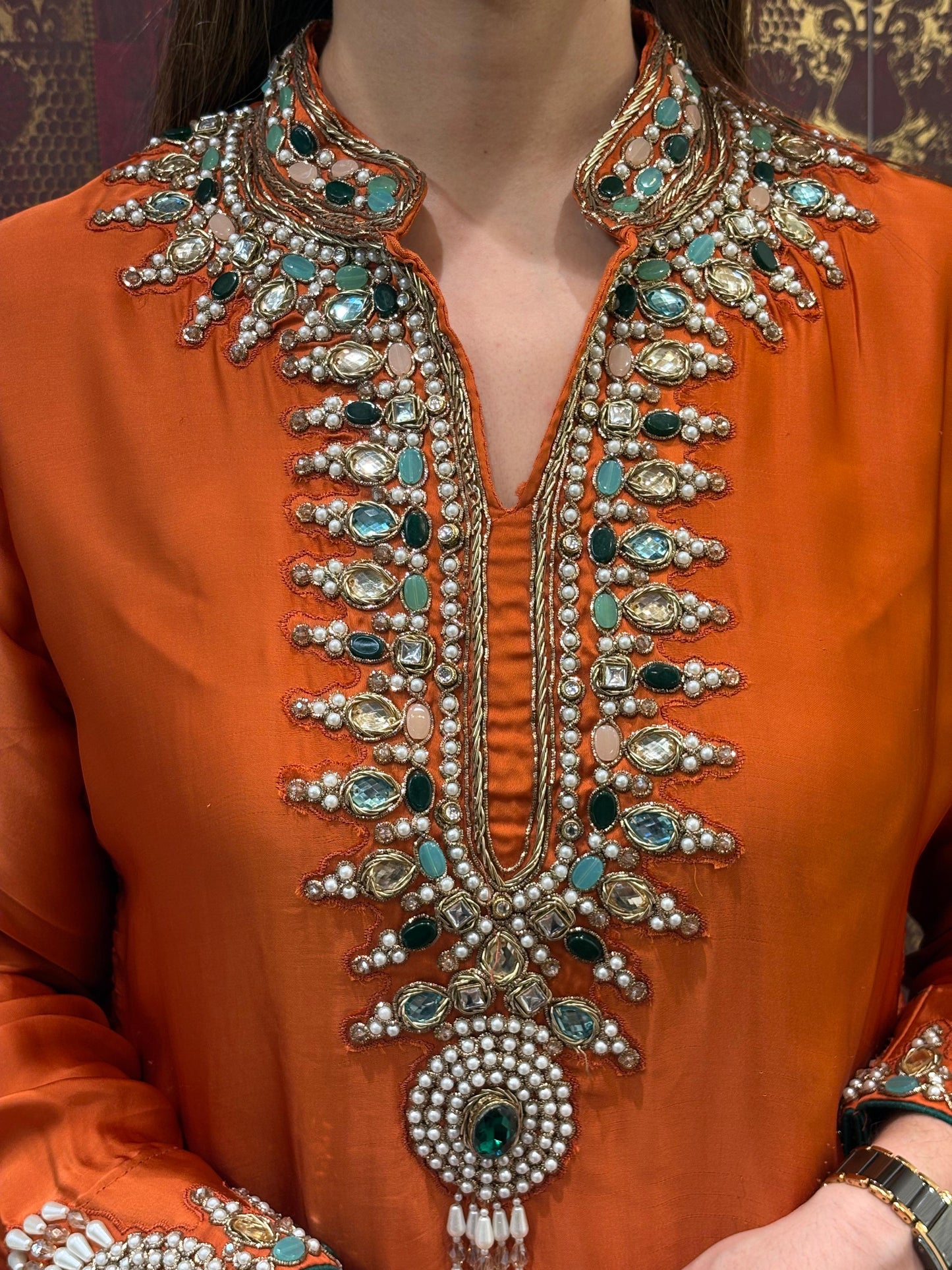 Elegant short kurta set is crafted in luxurious satin crape fabric