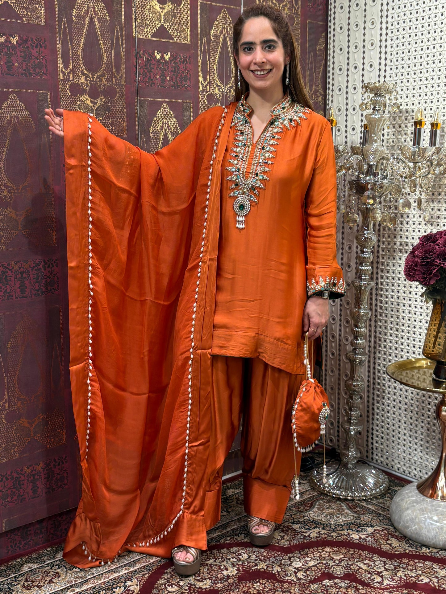 Elegant short kurta set is crafted in luxurious satin crape fabric