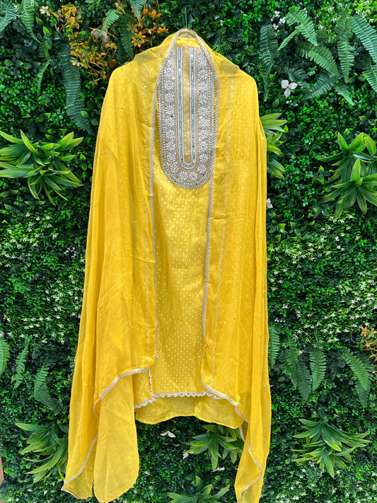 Step into timeless grace with this exquisite unstitched suit set