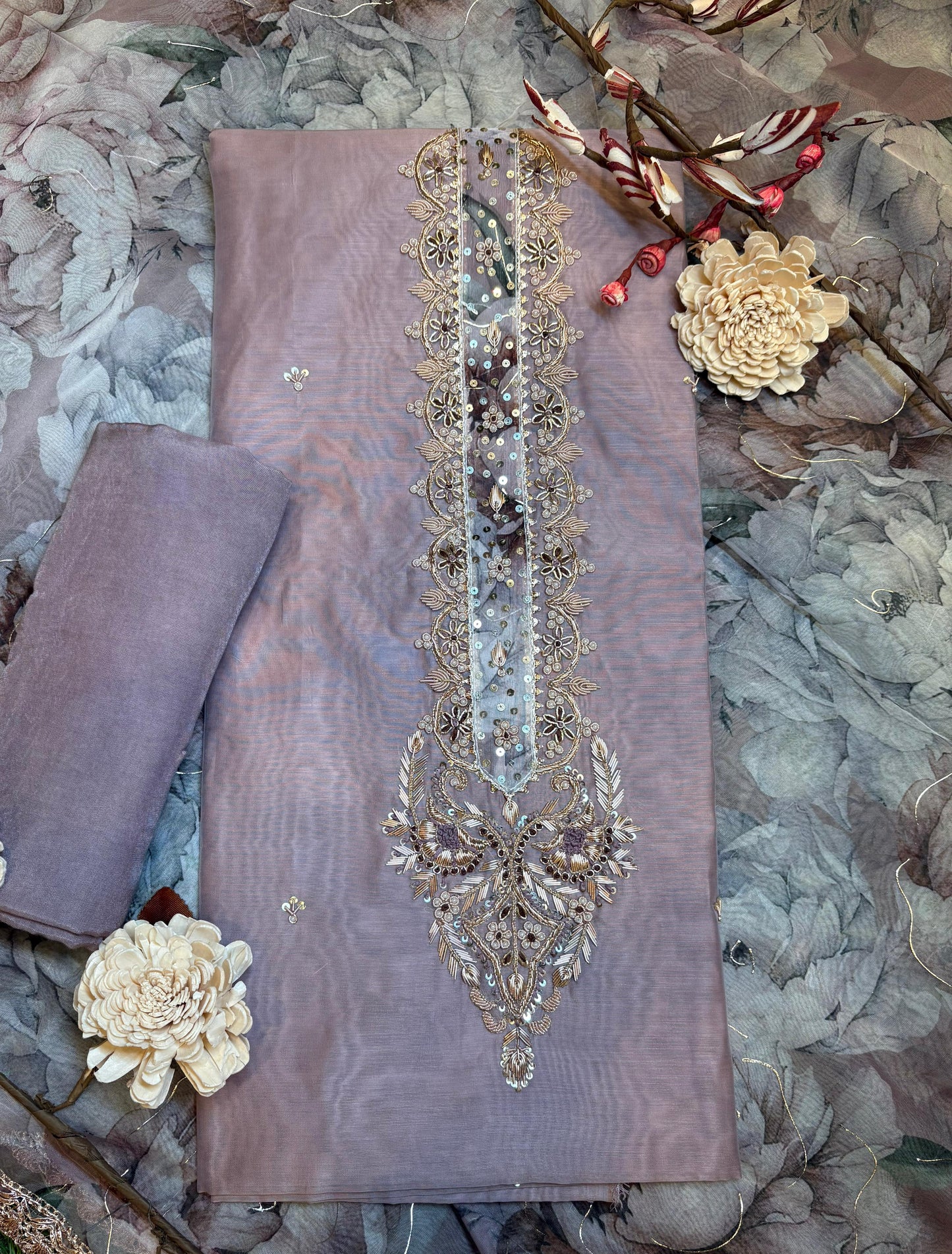 Discover timeless elegance with our premium unstitched suit