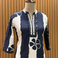 Chic navy and white suit set showcases a floral striped kurta