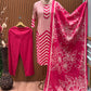 Vbrant pink and cream suit set features a stylish mix of vertical