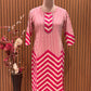 Vbrant pink and cream suit set features a stylish mix of vertical