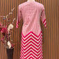 Vbrant pink and cream suit set features a stylish mix of vertical