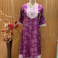 Vibrant purple ethnic set showcases intricate white thread embroidery
