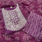 Vibrant purple ethnic set showcases intricate white thread embroidery