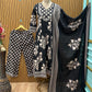 Black ethnic ensemble features elegant floral and vine prints